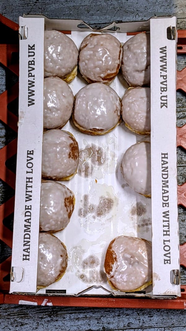 Another rusty-red plastic tray of iced doughnuts sat on the floor of my local Polski sklep